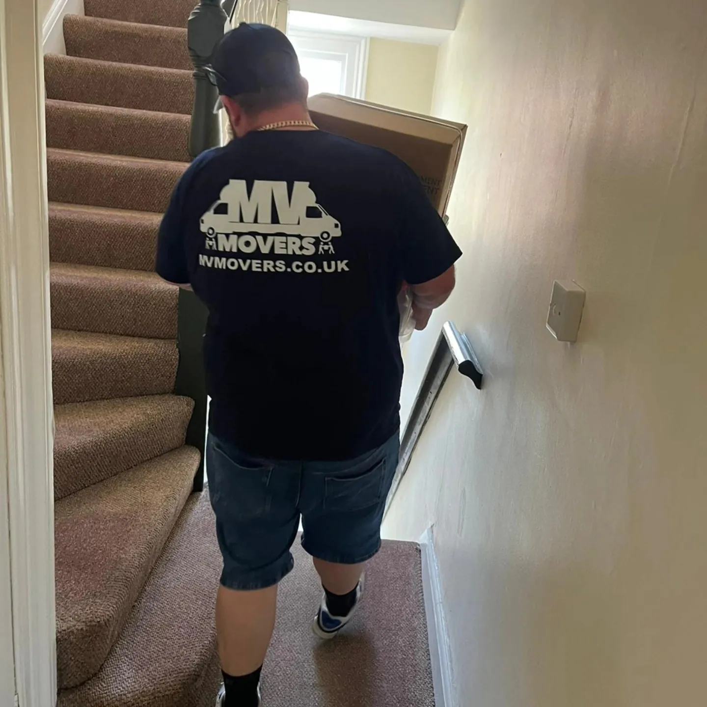Up the stairs – Carried, not dragged – MV Movers