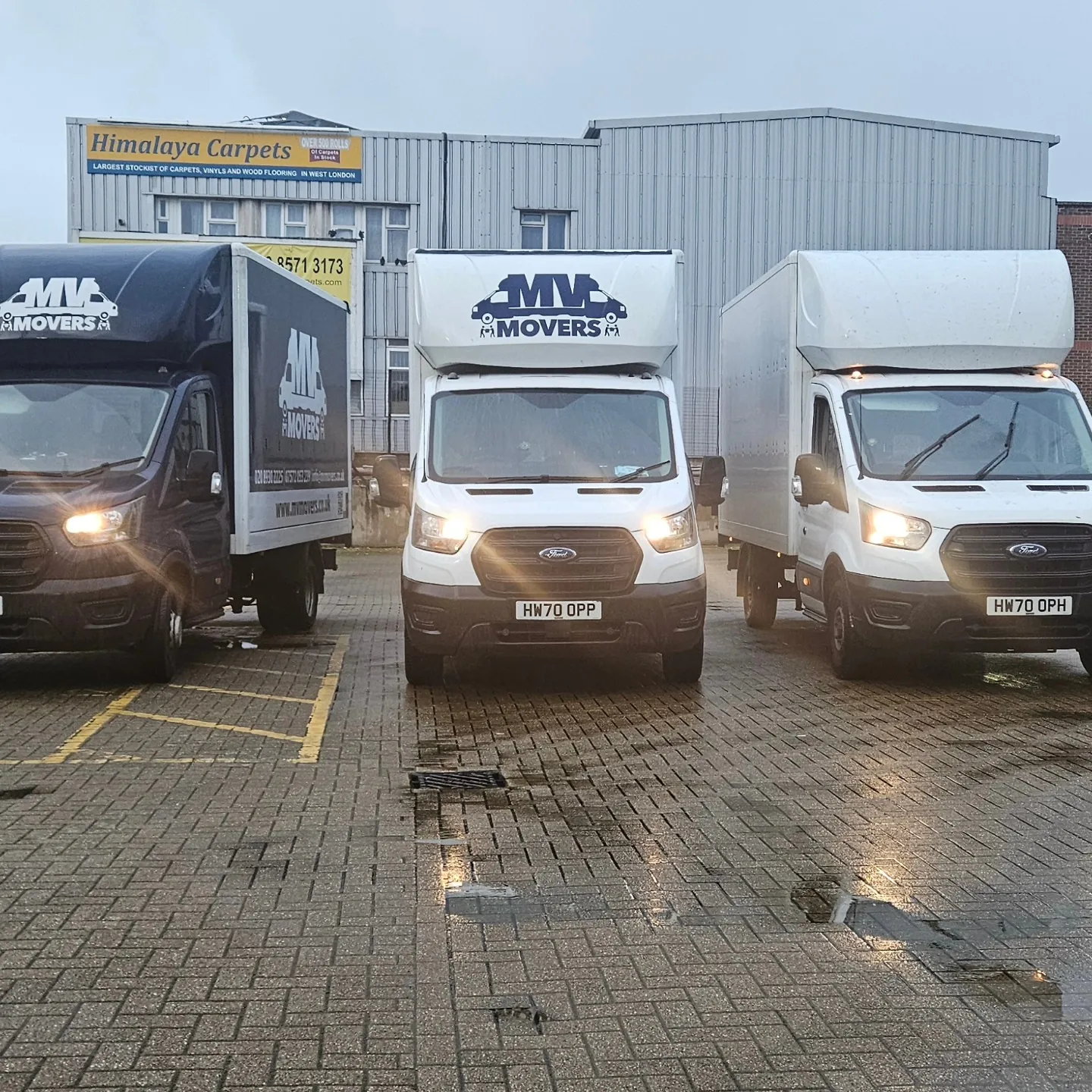 MV Movers fleet of three Luton removal vans at the Ealing base