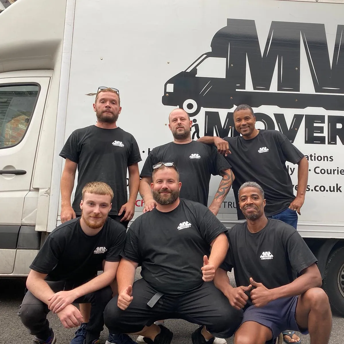 The MV Movers crew of seven in front of a van, Ealing removals team The MV Movers crew of seven in front of a van, Ealing removals team